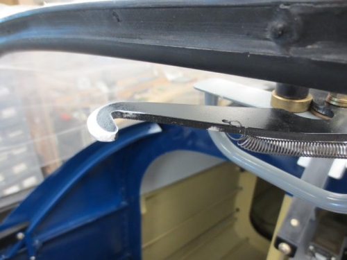 Sanded down leading edge of latch