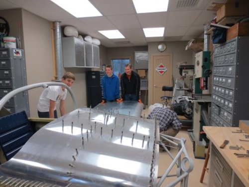 Family members helping with the left wing