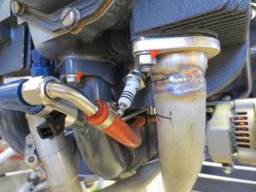 Fuel line too close to spark plug