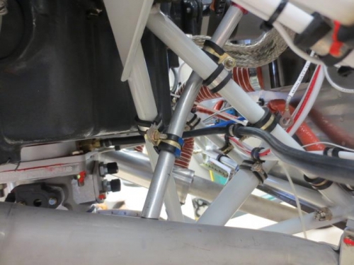 Crankcase breather on exhaust