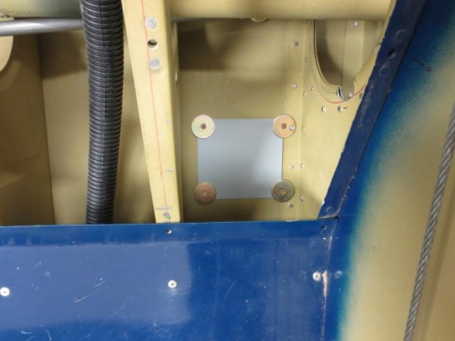 Spacers and shim plate under roll servo