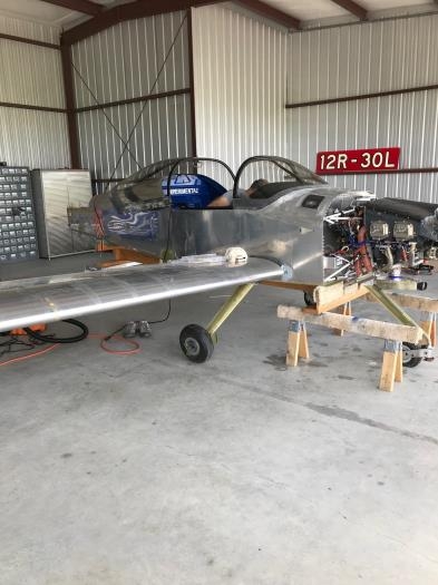 Wings in place on fuselage cradle