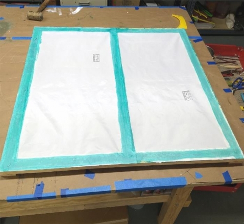 Fabric on frame awaiting shrink