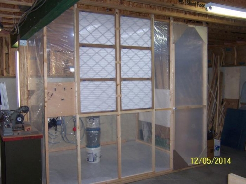 Paint booth fabricated from 2X2's and visqueen.