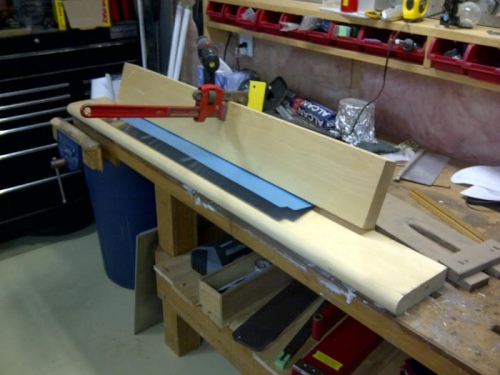 press with trim tab skin bent to final angle