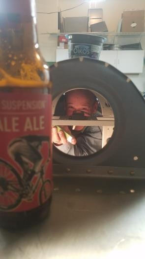 Darren enjoying a beer while I squeeze into the tunnel.