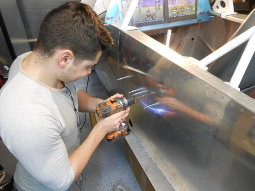 Drilling out the side rivets.