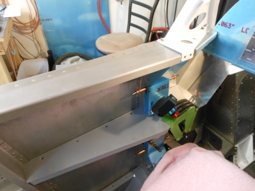 Armrest and forward console.