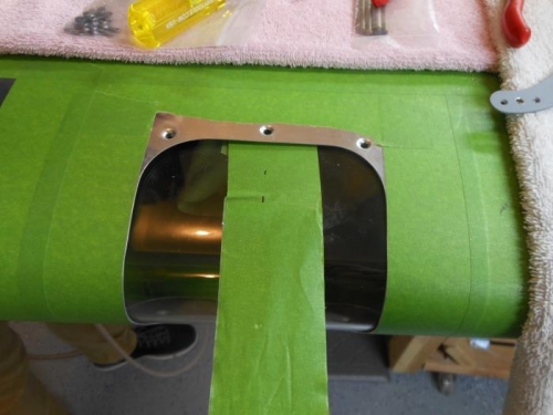 Lense held in place with a tape strap.