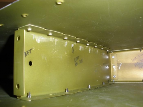 Aft middle rib being riveted to the skin.