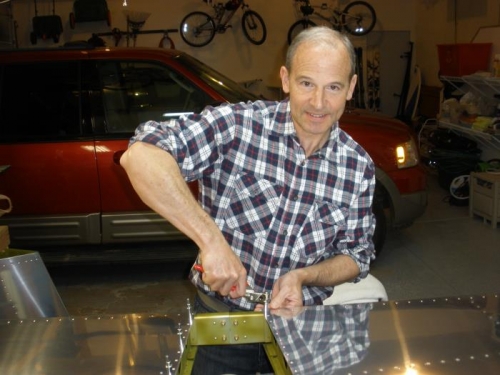 Riveting the inboard ribs.