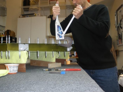 Riveting aft spar and top and bottom ribs in place.