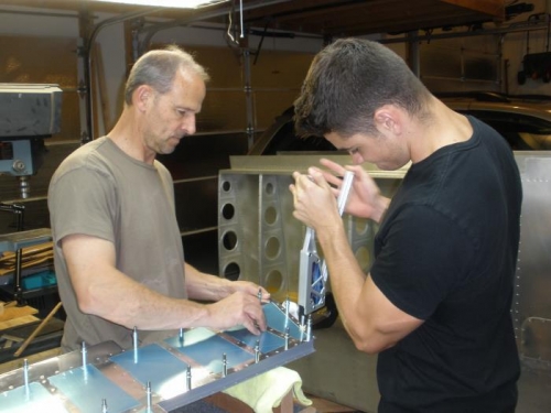 Riveting the elevator skins.