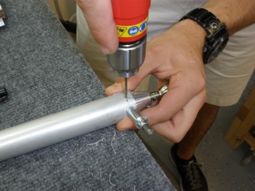 Drilling and clecoing pushrods.