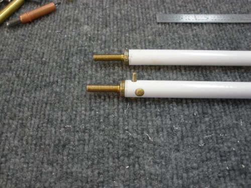 Shorter pushrod drilled, ready for rivets.