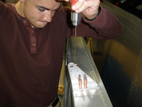 Match drilling the right inboard aileron bracket to the wing trailing edge spar.