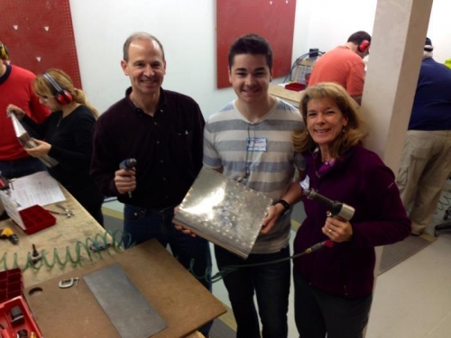 Riveting together our airfoil section.