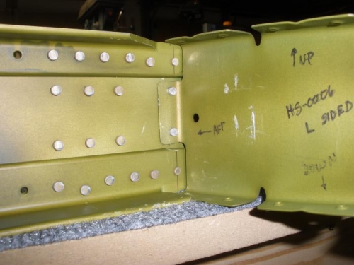 Left forward inboard rib riveted to forward spar.
