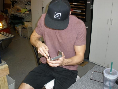 Parker deburring rudder parts.