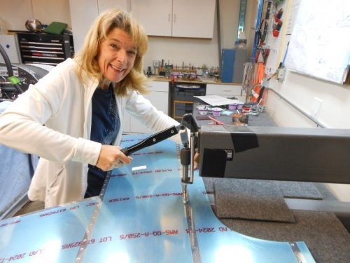 Terri dimpling after deburring the top forward skin.