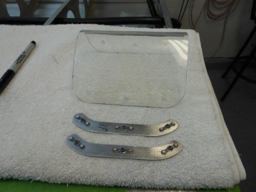 Lense drilled and countersink, nut plates on retaining strips.