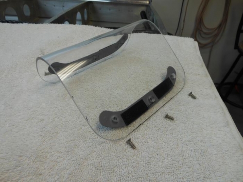 Retaining strips attached with double sided tape.