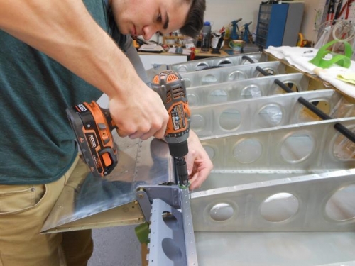 Parker adding a countersink to the rear spar.
