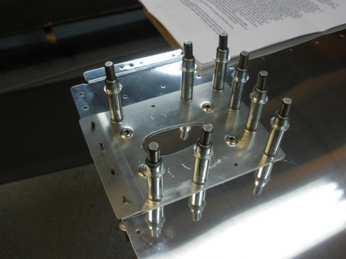 Backing plate match drilled and clecoed to wing skin.