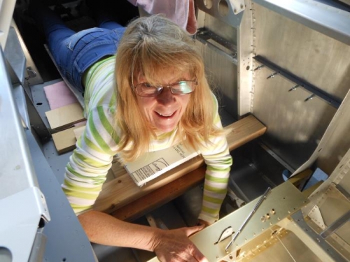 My wonderful wife attaching washers and nuts.