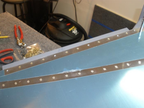 Skin riveted with rudder bottom attach strips.