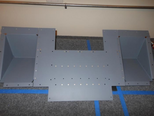 Back riveting the footwell assembly.