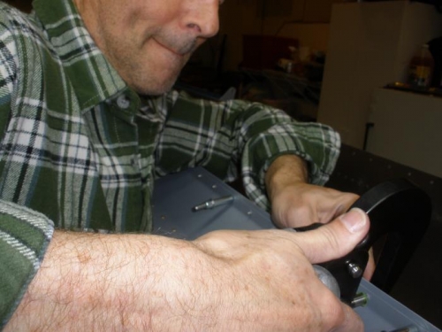 Riveting Aileron Gap Fairing to the trailing edge skin.