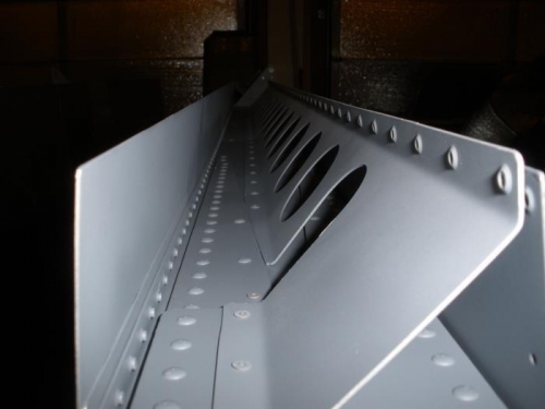 Flap Brace attached to rear spar with blind rivets.