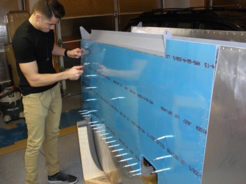 Clecoing the wing skin to the spars and ribs.