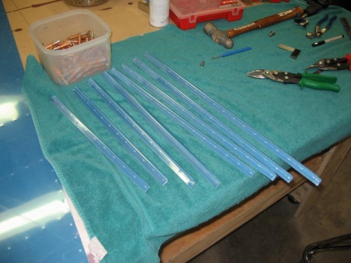 Half the rudder skin stiffeners trimmed to length