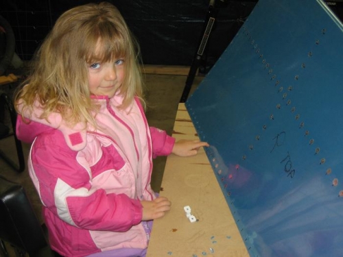 Alex Helping Pull Protective Plastic from Around Rivet Holes