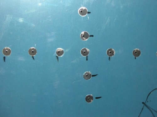Close up view of exposed rivet holes