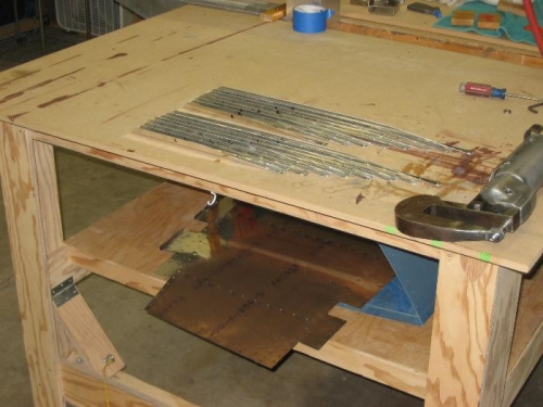 Rudder stiffeners on top of table, skins on shelf