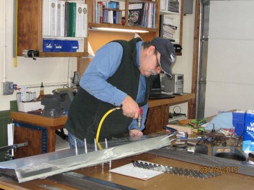 Drilling and cleco'ing ribs to rudder skin.