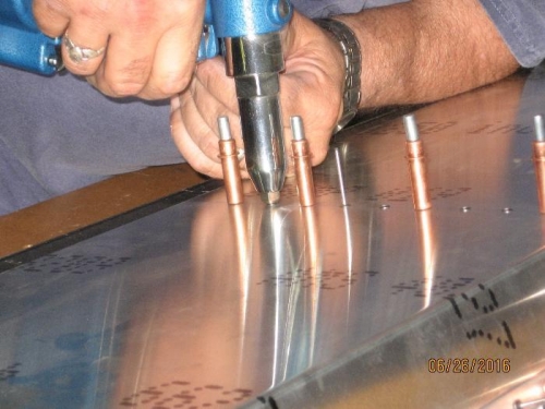 Setting rivets.