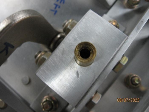 Concentric brass tubes in attach block guide hole, which act as mini drill bushings.