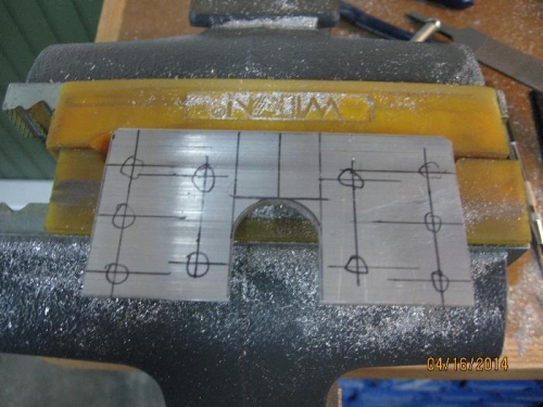 Round slot cut out and angle marked for pilot holes.