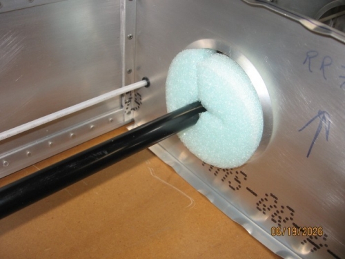 Foam insert in lightening hole to help support the long aileron pushrod.