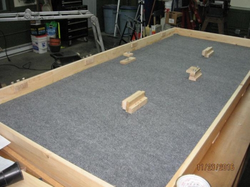Box lined with carpet for protection.