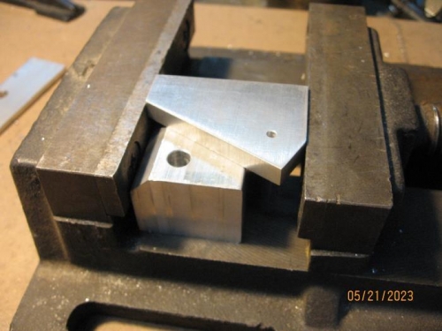 Resdy to up-drill the spacer block to the proper hole size.