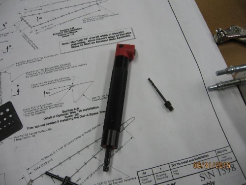 Right angle drill attachment for drilling in tight spaces.