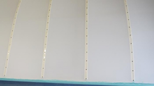 Riveted cap strips to ribs