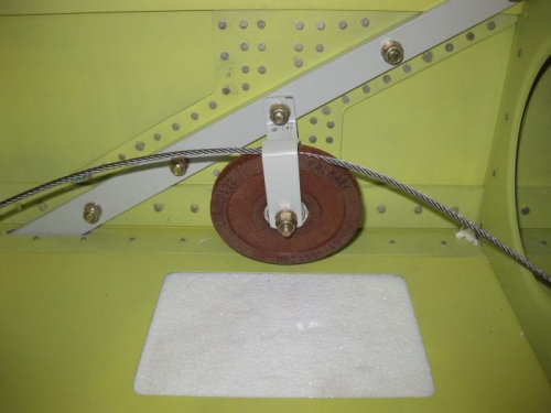 Pulley at wing strut location