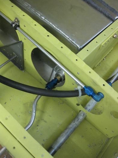 Rear main line outlet and lower sighting gauge fuel lines