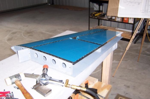 Riveting the aft spar to the VS
